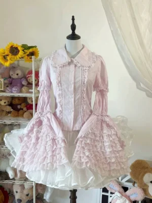 Pink Sweet Lolita cotton blouse with lace-trimmed Peter Pan collar and detachable hime sleeves displayed on dress mannequin in cozy bedroom setting