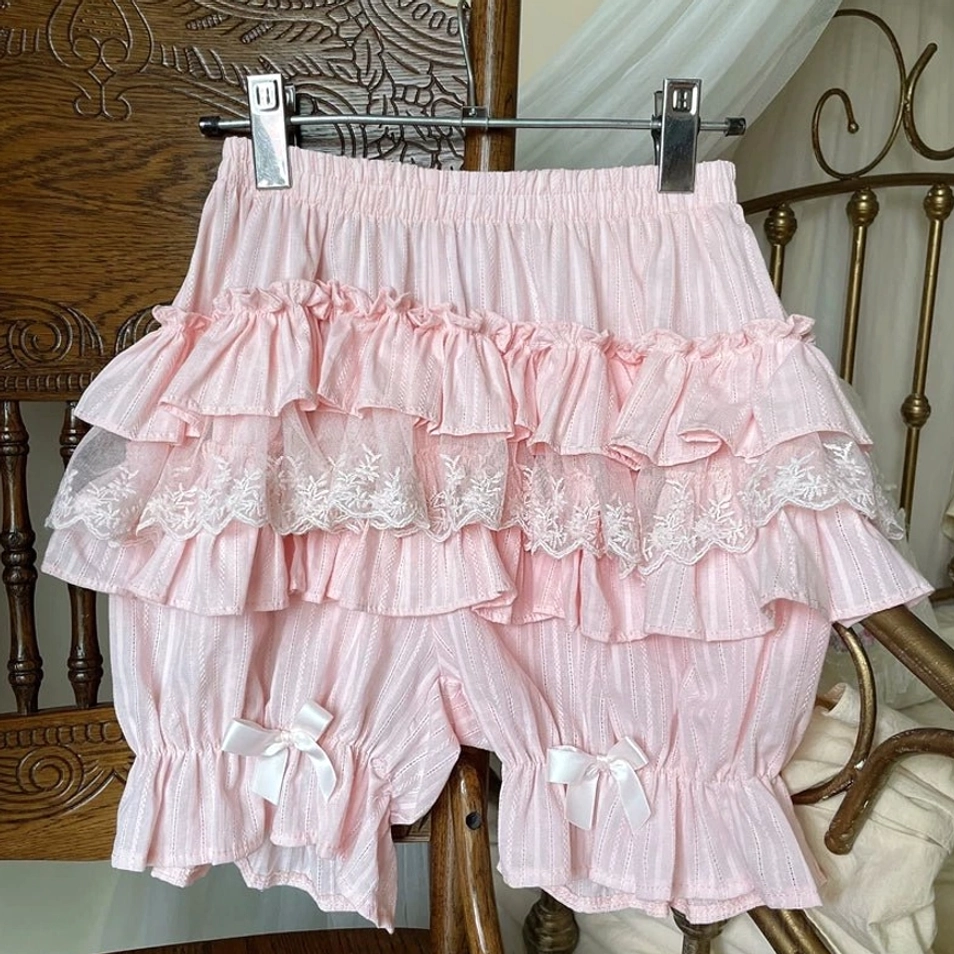 Pink layered ruffle sweet lolita cotton bloomers hanging vintage wooden chair clothes hanger tiered ruffles lace trim white satin bows leg cuffs display