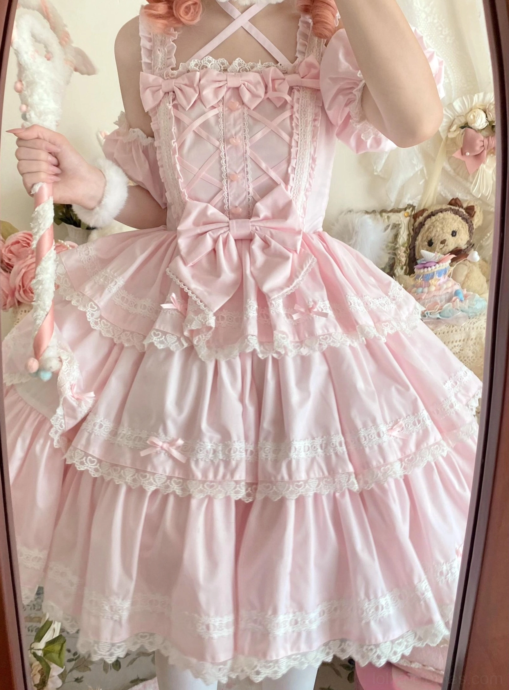 Pink Sweet Lolita JSK front close-up view crisscross bodice straps lace-trimmed large front waist bow magic wand prop vintage bedroom decor