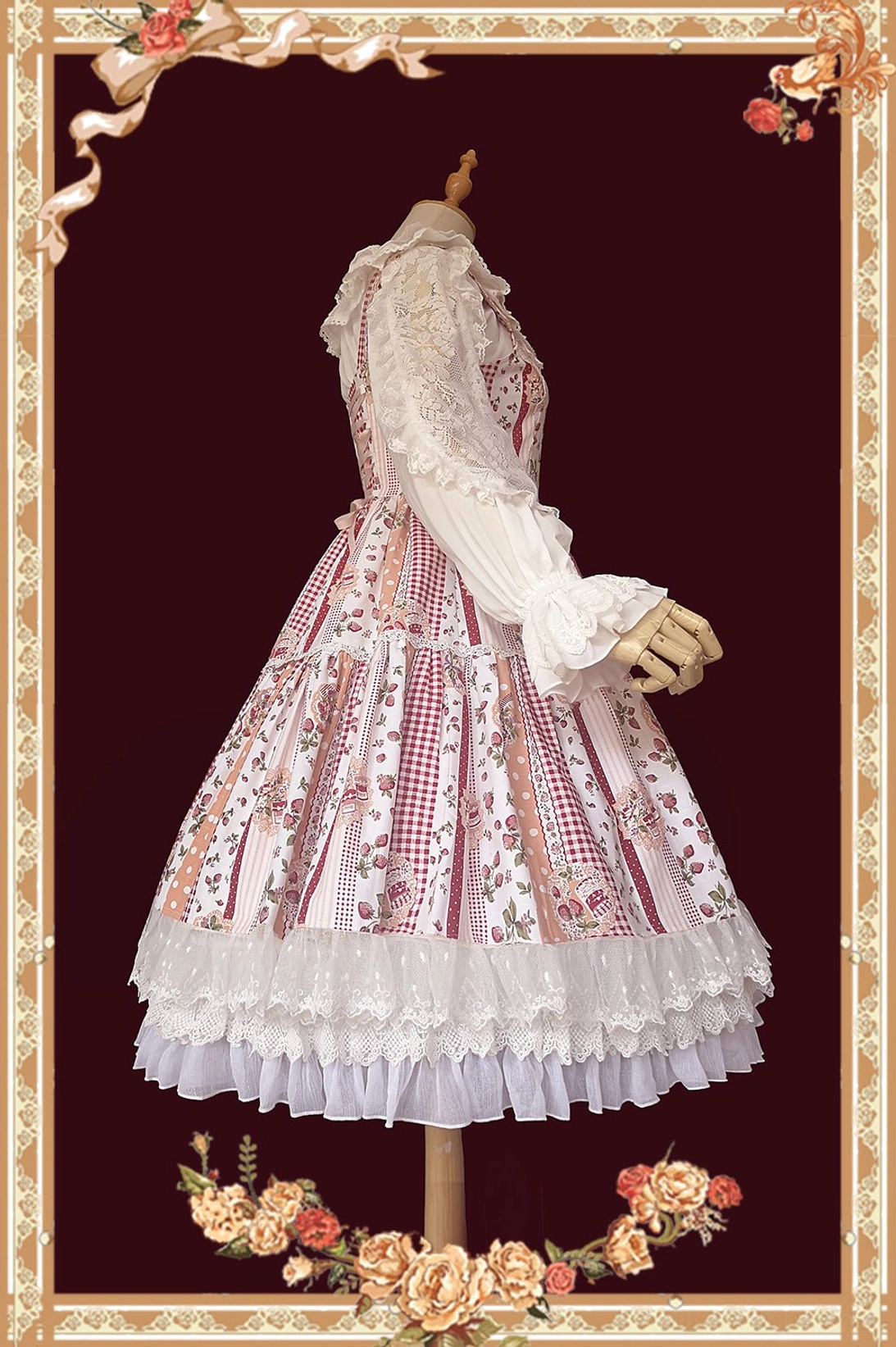 Pink strawberry gingham sweet Lolita JSK dress back view showing lace ruffled hem, adjustable shoulder straps, patchwork skirt design, vintage floral frame background