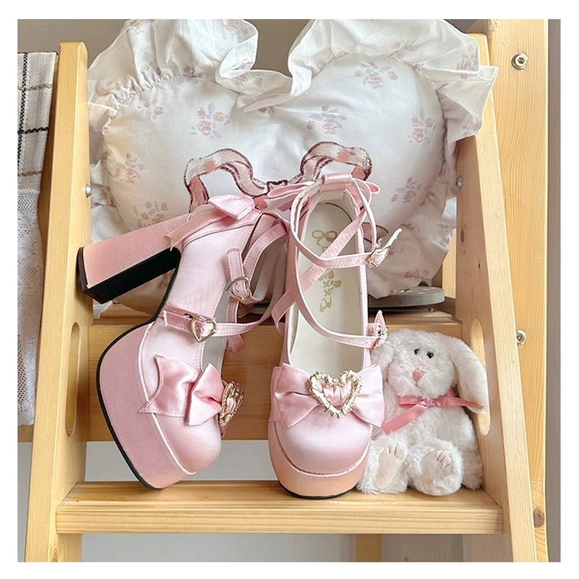 Pink Sweet Lolita Mary Jane heart heels side profile view on wooden shelf showing block platform heel and ankle strap buckle detail