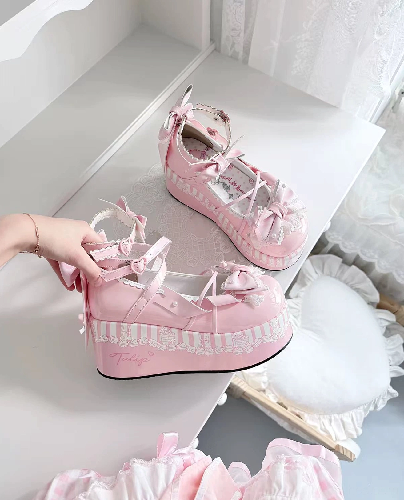 Pink sweet lolita platform Mary Jane shoes with front bow decorations, thick platform sole, paired with floral printed white thigh highs mirror reflection in bedroom vanity