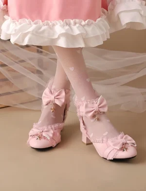 Pink Sweet Lolita Mary Jane shoes with star charm bow and ruffled ankle strap worn on model feet, paired with pink ruffled skirt and heart print tights