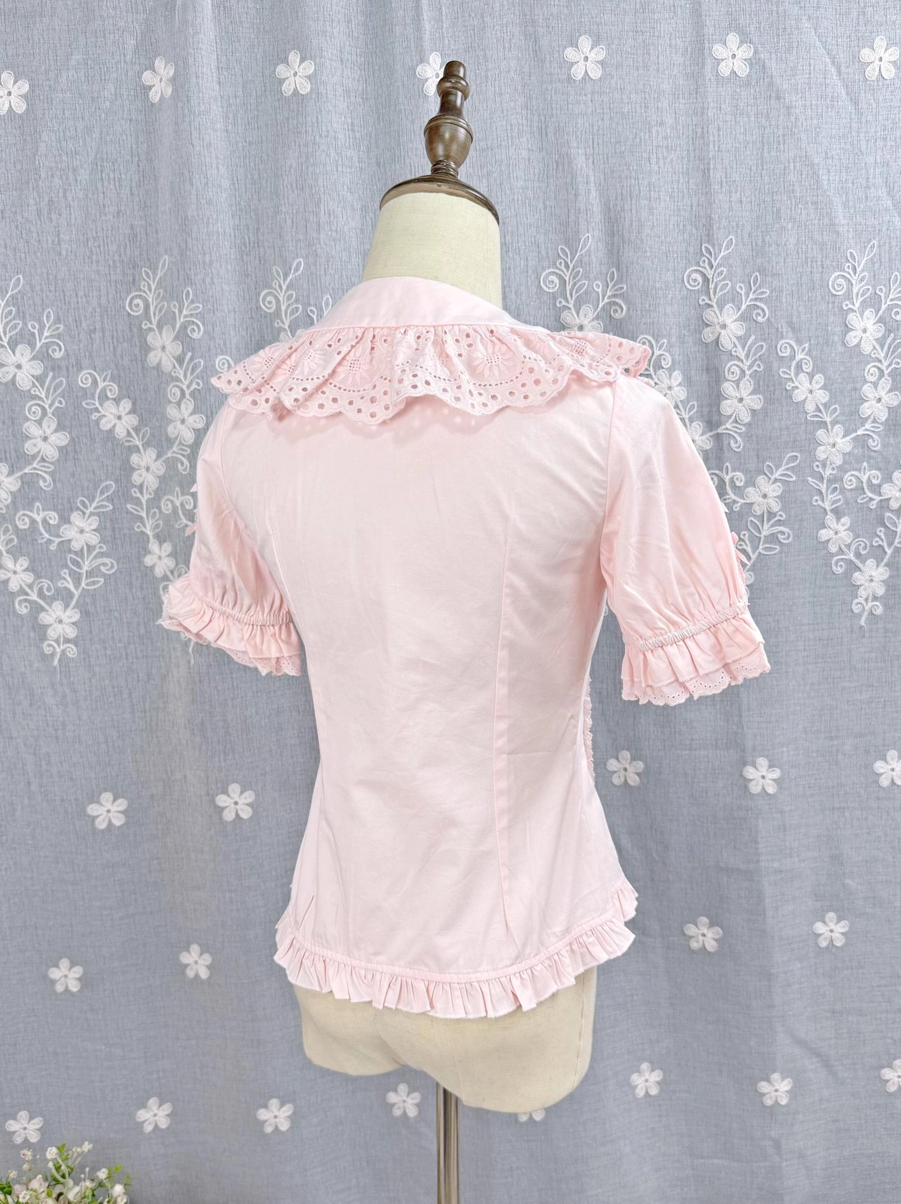 Pink Sweet Lolita Peter Pan collar short-sleeve blouse back view showing ruffled lace collar cuffs and hem details