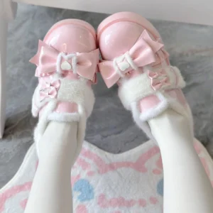 First-person on-foot view of pink Sweet Lolita winter warm platform shoes with heart buckle bow detail and fuzzy plush collar, worn with white thigh-high stockings on heart print rug backdrop