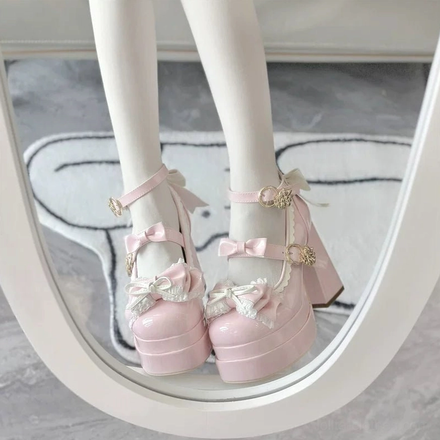 Pink sweet Lolita round toe platform heels front view worn on-foot with gold buckles ruffled bow trim and block platform design