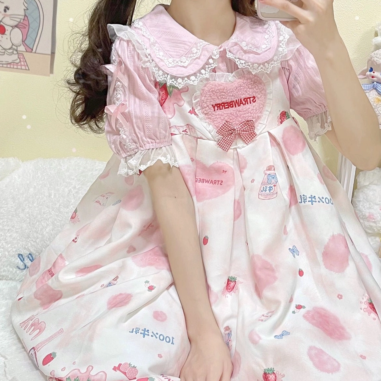 Pink sweet lolita blouse strawberry print with lace-trimmed doll collar heart embroidery on female model indoor