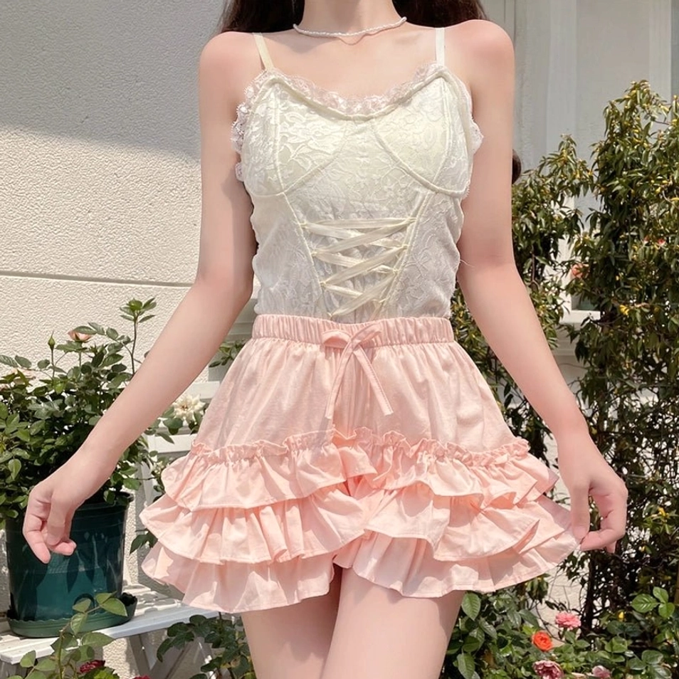 Side front close-up pink tiered ruffle safety bloomers layered ruffles lightweight flowy pure cotton fabric polished seams detail view