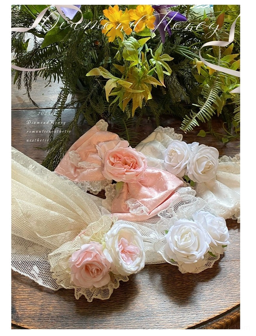 Pink and white floral tulle hair accessories in multiple sizes coordinating with princess bridal lolita wedding dress
