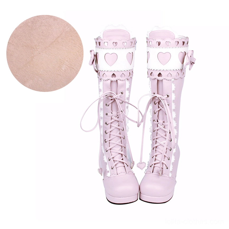 Pink and white sweet lolita mid-calf thick heel boots front view showing heart cutouts satin bows and layered lace design elements