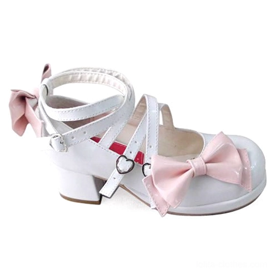 Top-down product shot of two-tone pink and white shining Lolita Mary Jane shoe with crisscross straps, heart-shaped buckle, and rear heel bow accent