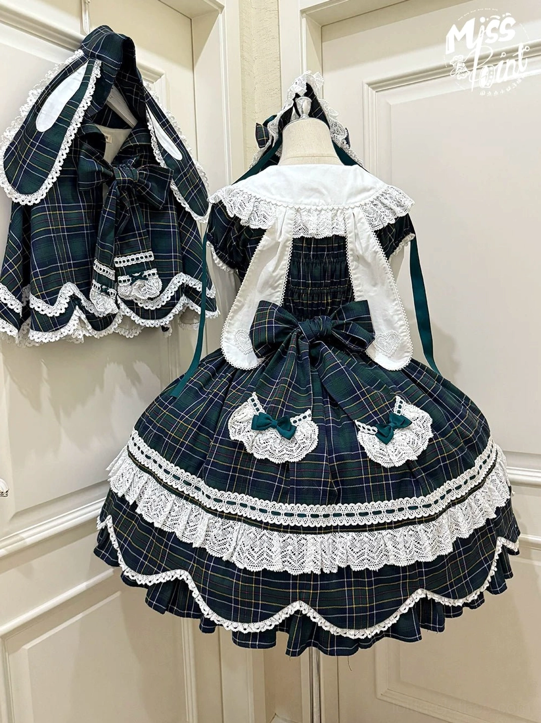 Plaid lolita OP dress front view showcasing petal-shaped hem with lace trim, multi-layer bow embellishment, and square neckline Old School design