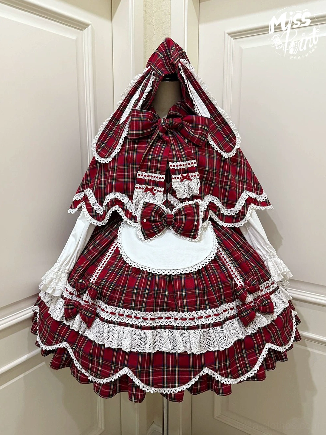 Plaid lolita OP dress showing functional side zipper closure and pocket placement details for practical wearability design
