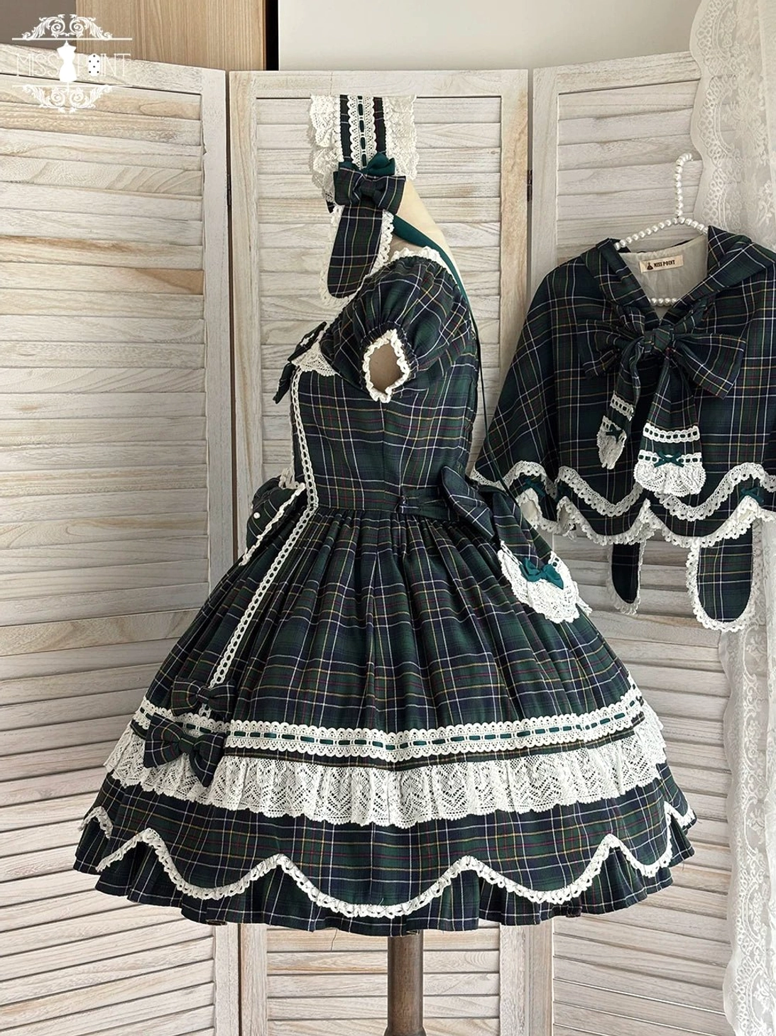 Plaid lolita OP dress model wearing with matching hair bow and lolita accessories demonstrating coordinated Old School styling options