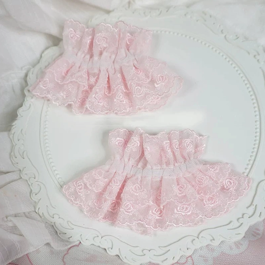 plain pink lace sweet lolita wrist cuffs pair with ruffled rose pattern embroidery no bows or pendants elastic gathered structure flat lay