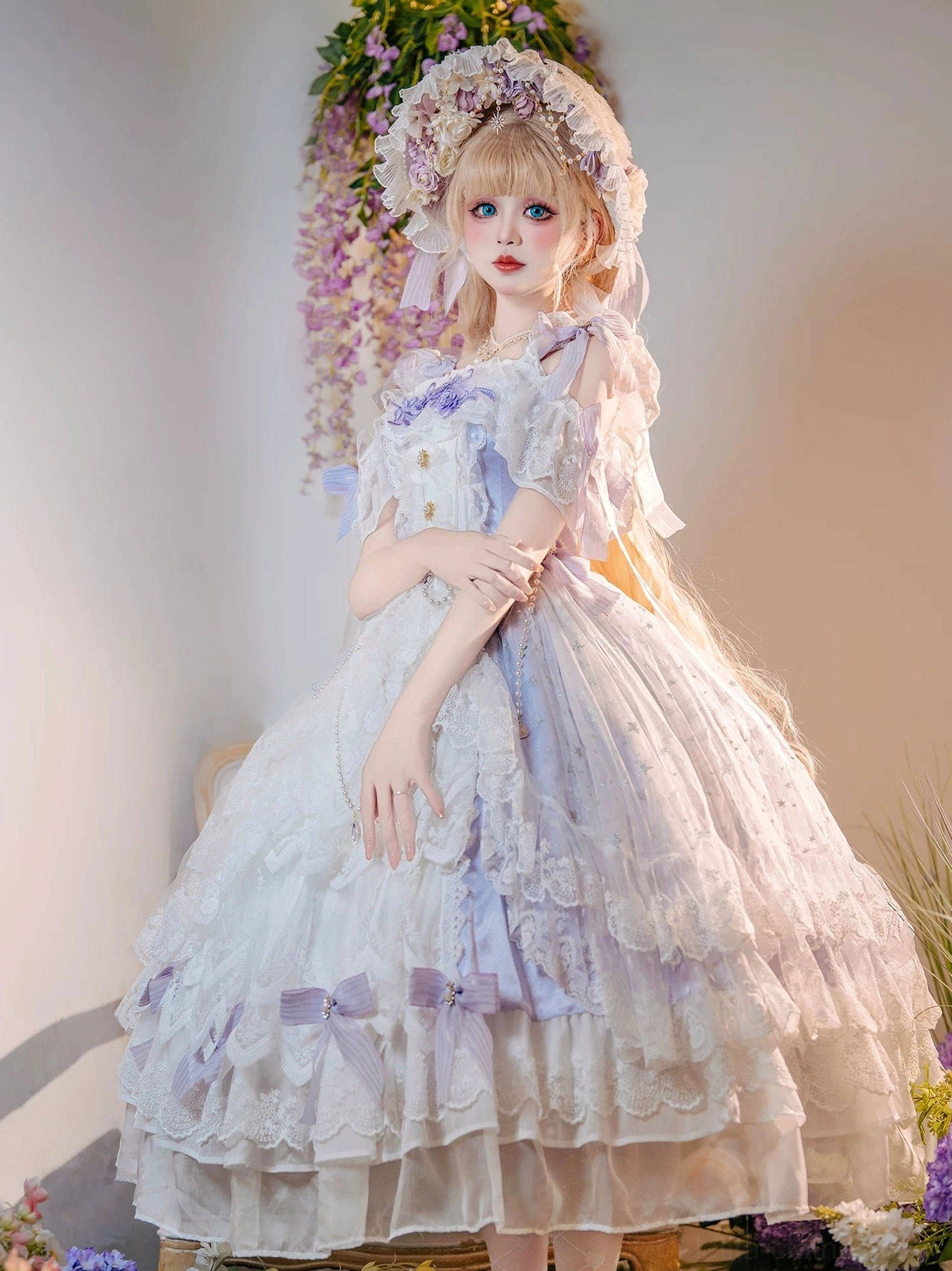Plus size bridal lolita JSK with decorative front bodice buttons, purple ribbon trims, sheer lace overlay, and full tiered skirt, frontal pose with crossed hands