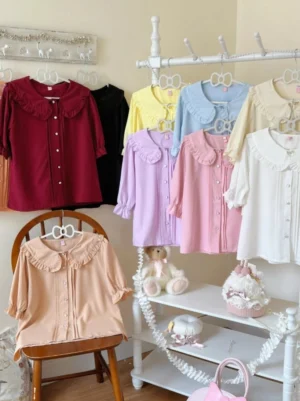 Plus size kawaii lolita blouse with Peter Pan ruffled collar and cinched cuffs in multiple solid colors including purple and yellow short sleeve and long sleeve options for sweet and classic lolita fashion