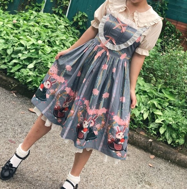 Plus-size lolita blouse in light pink color option showing peter pan doll collar ruffled cuffs and front button details displayed on mannequin or lay flat for color and style clarity