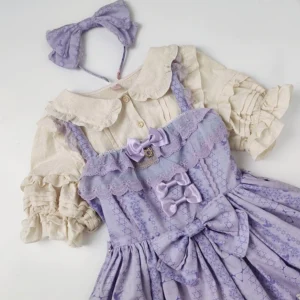 Purple Lolita JSK dress with beige ruffled short-sleeve cotton blouse, matching headband, lace trims and star-cross pattern print on dress with ruffled puff sleeves, overhead flat lay view