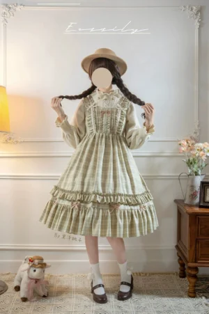 Classic lolita green plaid jumper skirt dress with layered ruffled hem and frilled collar detail on full-body model in vintage European indoor setting, front eye-level view