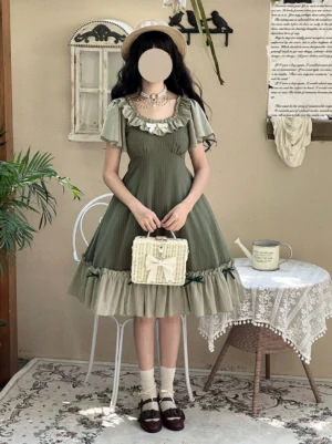 Plus size lolita OP dress olive green with vertical stripes, ruffled collar, flutter sleeves, front full-body shot in vintage tea house scene with woven handbag