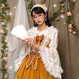 Plus size lolita princess sleeve blouse front view with pleated round neckline and lace trim details worn by model with vintage styling