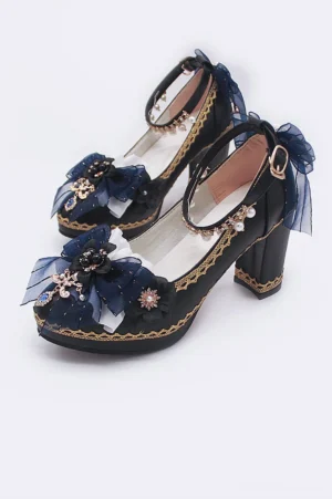 45-degree side view of pointed-toe lolita wedding high heels with black pu leather gold lace trim navy blue mesh bow ruby pendant and adjustable ankle strap