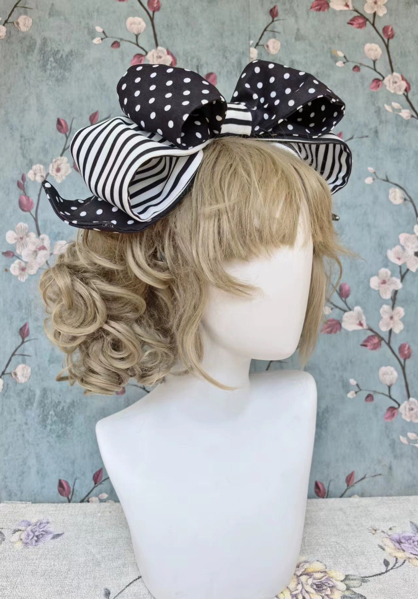 Black and white polka dot old school lolita headbow with double-layer design, stripe edge trim, and matching small decorative hairpins for complete ensemble