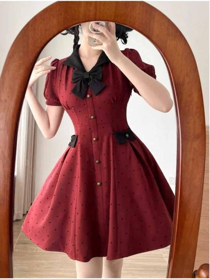 Polka-dot classic lolita OP dress side view mannequin showing a-line midi skirt silhouette side pockets functional design vintage