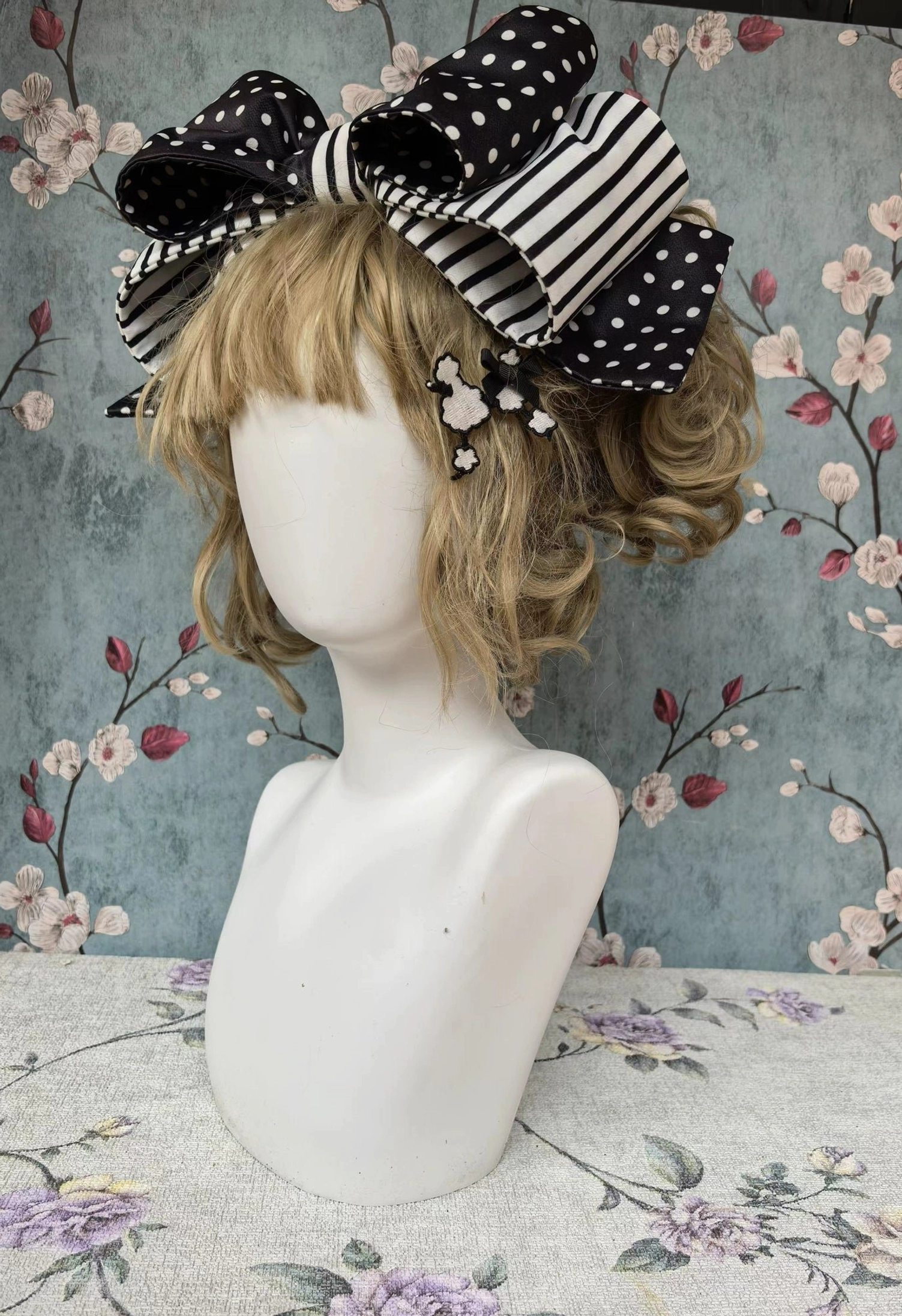 Coordinating lolita KC headbow with dual-layer polka dot and stripe pattern, poodle embroidery patch, and small flower hairpin decorations on blonde wig