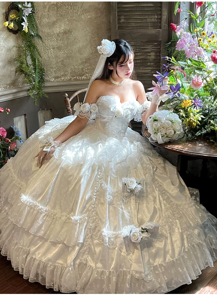 Outdoor front view of white tulle princess bridal lolita gown with 3D rose appliqués and wedding bouquet