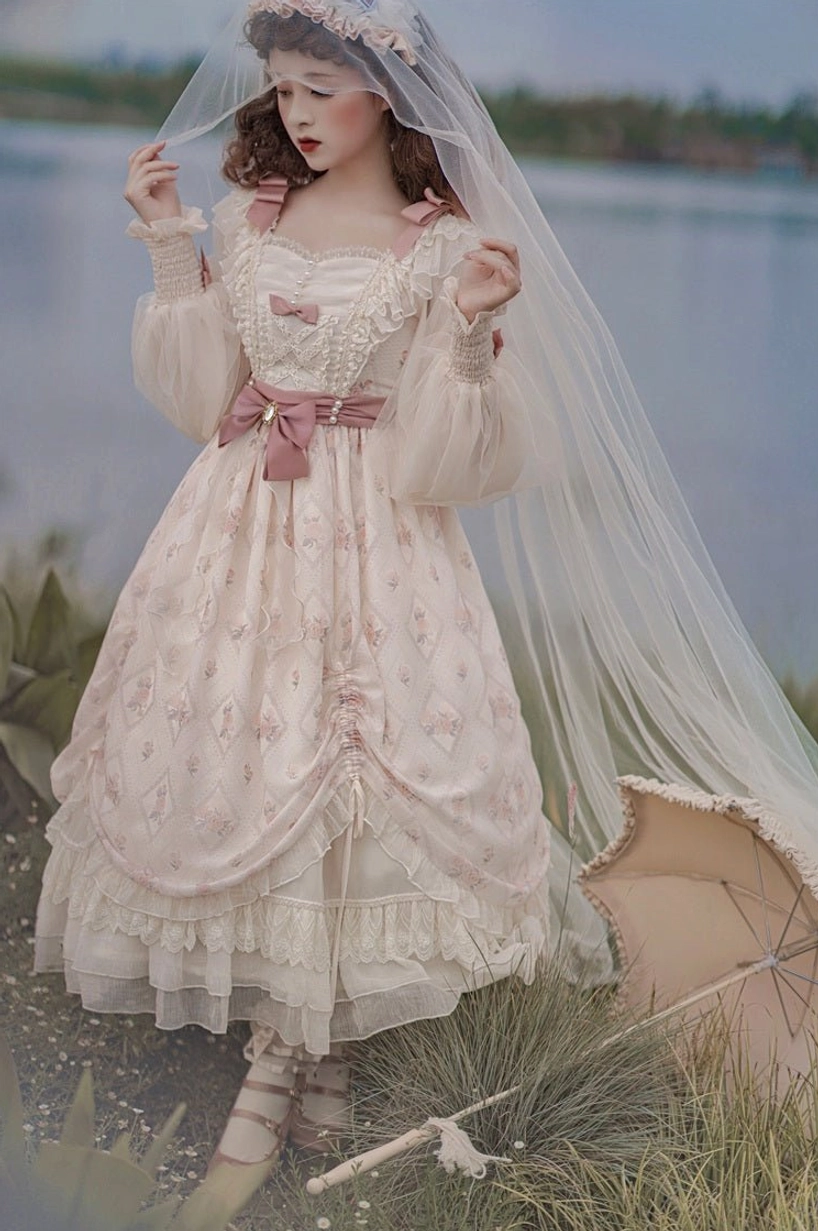 Princess lolita OP dress back three-quarter view featuring layered ruffled skirt construction, subtle floral pattern, pink bow, sheer puff sleeves from rear angle