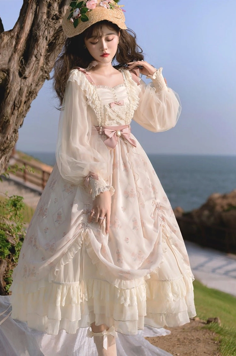 Princess lolita OP dress full front view with voluminous layered skirt, ruffled square neckline, lace-trimmed sheer sleeves, large pink waist bow statement detail, elegant silhouette
