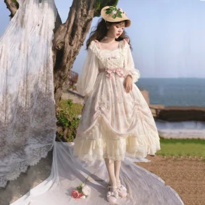 Princess lolita OP dress side three-quarter angle showing sheer lantern sleeves, double-layered ruffled skirt hem, square neck with ruffled trim, pink waist bow detail, vintage seaside aesthetic with lace drape