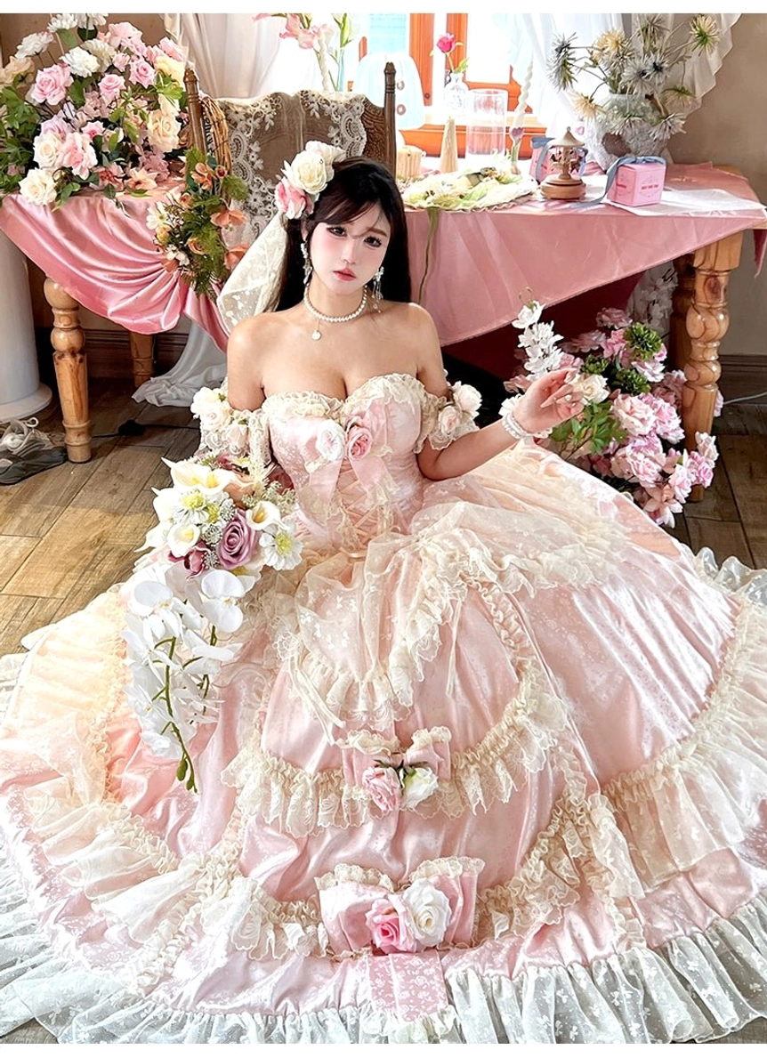 Close-up detail of white 3D rose appliqués and jacquard fabric on princess bridal lolita gown bodice