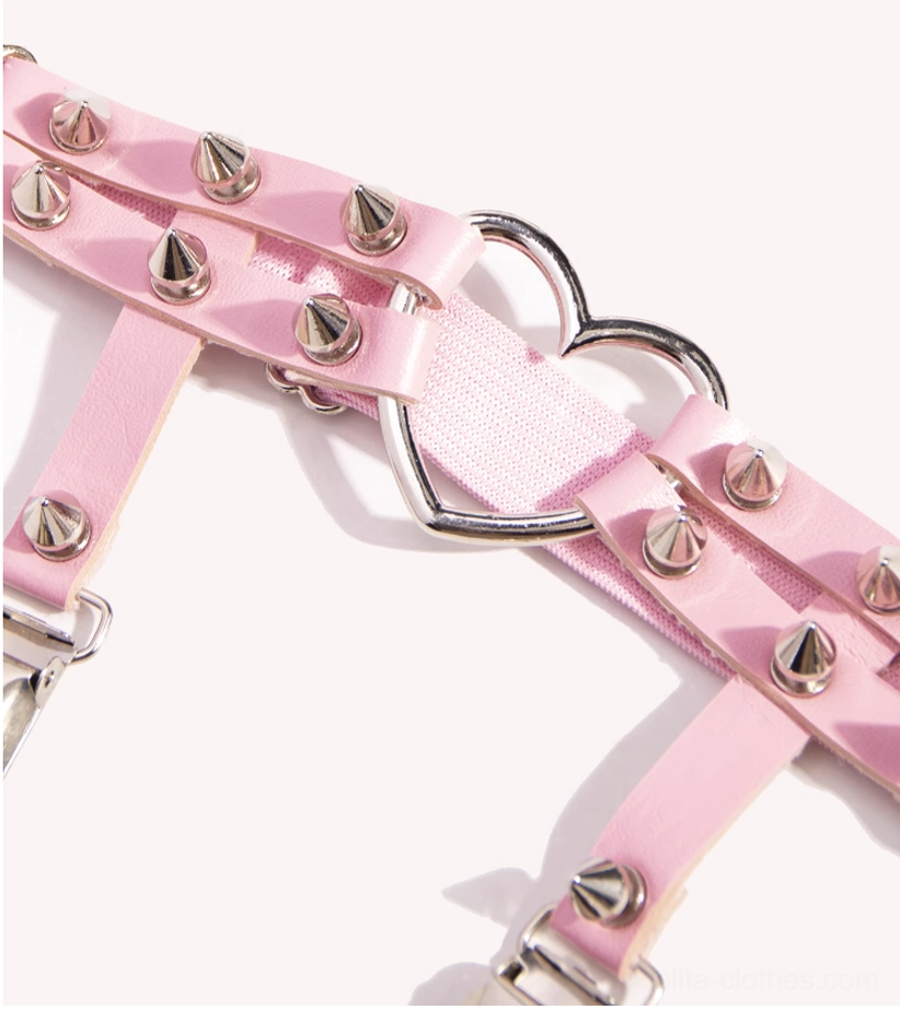 Close-up of pink Punk Lolita heart rivet stocking garter clip and silver metal clasp
