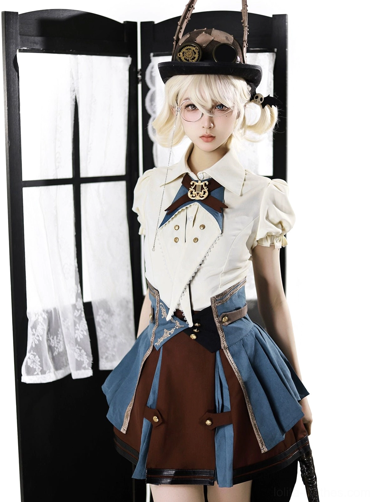 punk lolita three-piece suit full body front standing model wearing round glasses steampunk top hat bow necktie metal brooch