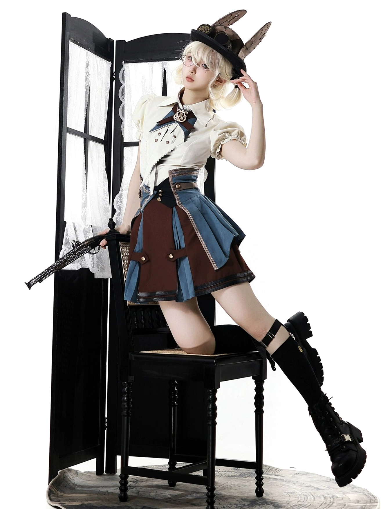 punk lolita three-piece suit dynamic sitting pose model on vintage chair platform boots thigh high socks two-tone skirt
