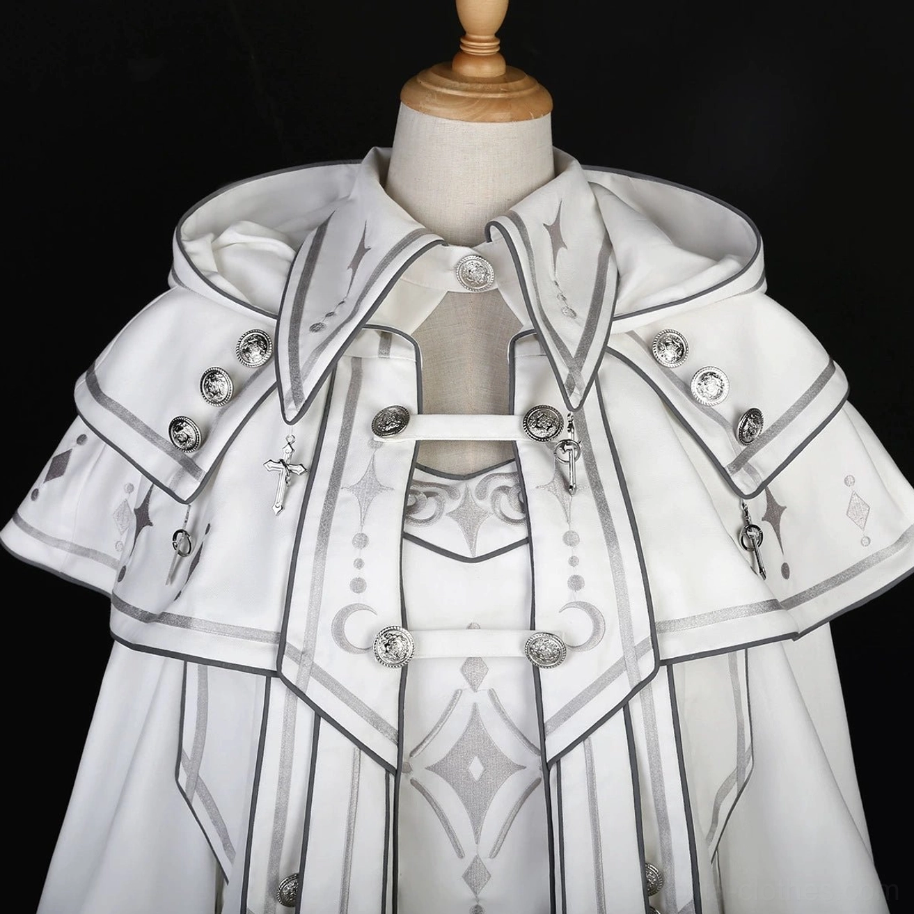 Full ensemble laying flat display of ethereal punk ouji lolita white three-piece set showing complete top, hooded cape, shorts, and all embroidery celestial motifs