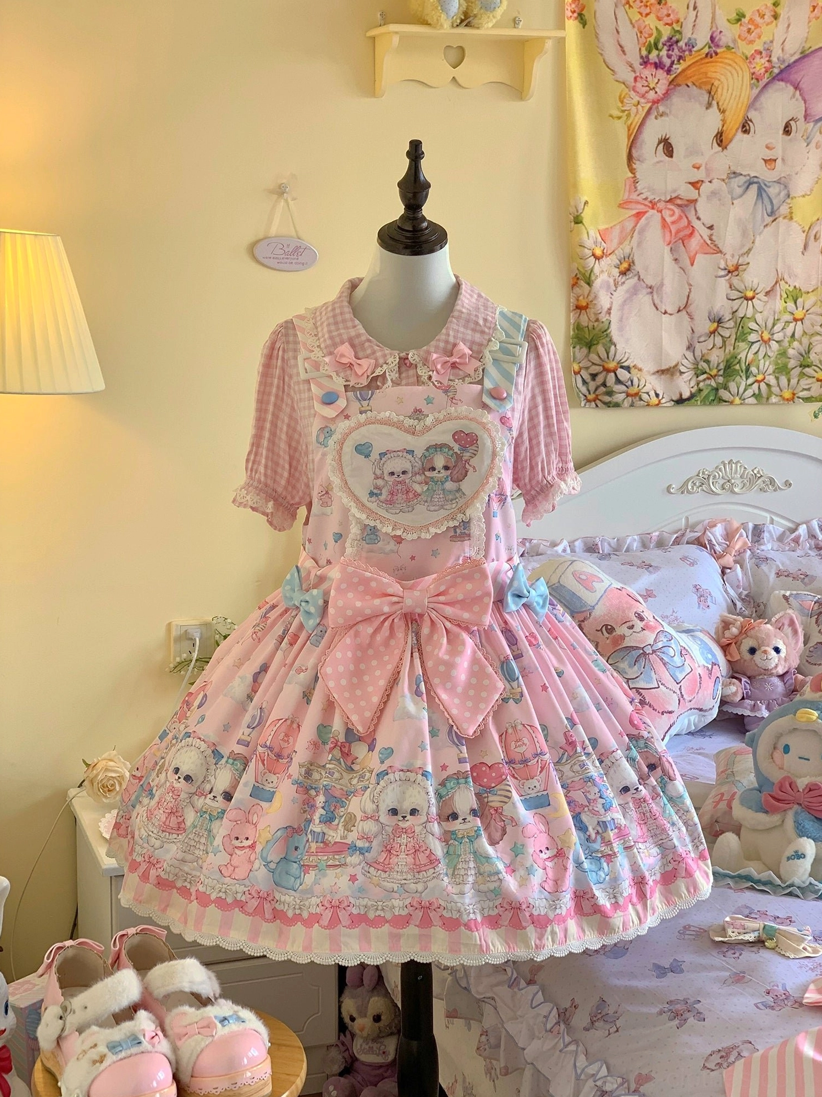 Puppy Lolita salopette back design showing large decorative bow and ruffled skirt hem Sweet Lolita classic elements