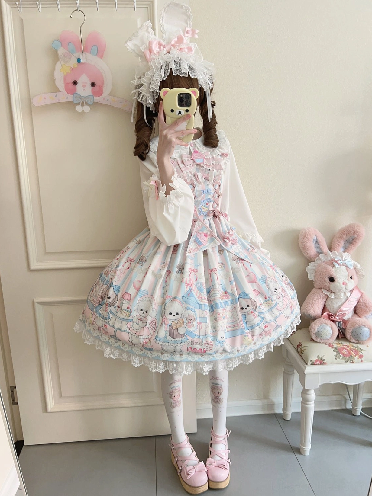 Side profile of puppy print Lolita JSK coordinate featuring twin-tailed girl wearing printed stockings and Mary Jane shoes, demonstrating sleeve and hem details of sweet Lolita jumper skirt