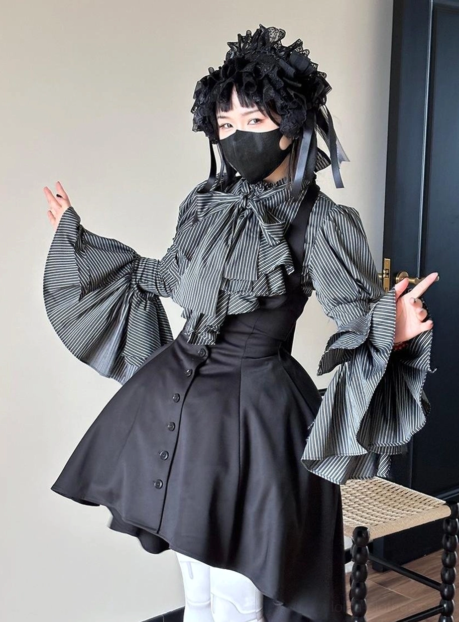 Pure black Gothic Lolita striped blouse variation displayed on mannequin showing all-black colorway with ruffled jabot and puffed sleeves for traditional goth aesthetic