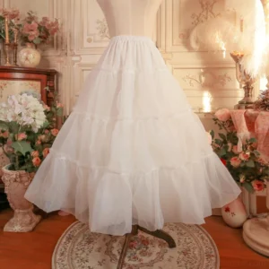 Pure white smooth layered tulle lolita petticoat front full view on mannequin, demonstrating multi-layer organza construction and classic a-line silhouette in vintage studio decor