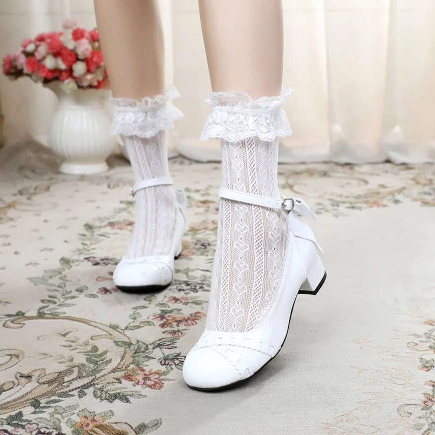 Pure white sweet lolita Mary Jane round toe leather flat shoes with white ankle buckle strap and decorative rear bow, stitched vamp details, model wearing ruffled lace socks
