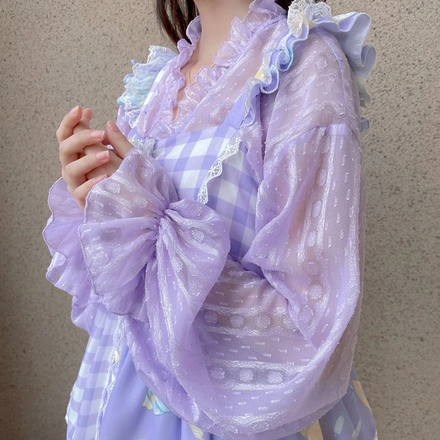 Light purple jacquard sheer chiffon puff sleeve Lolita cardigan with detachable front bow and ruffled cuffs worn over purple checkered dress