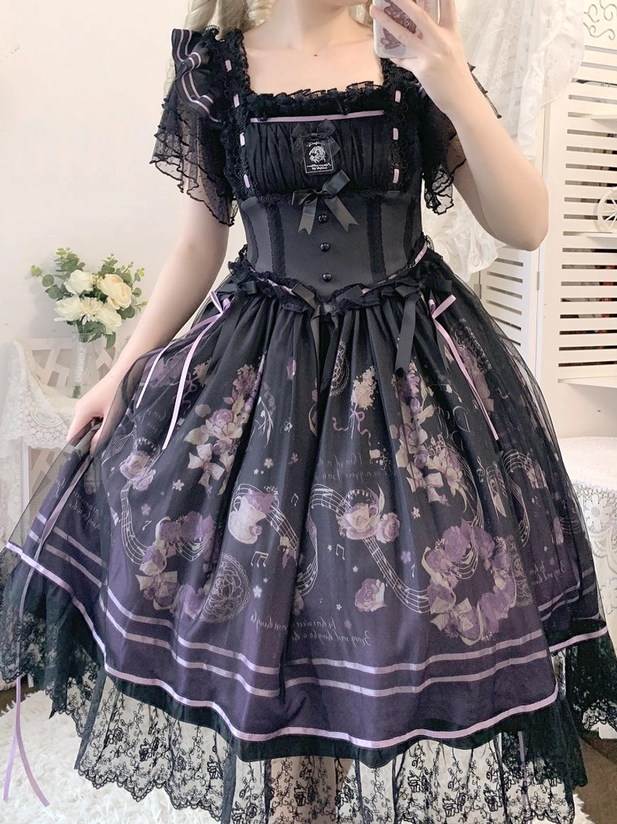 Purple floral print Gothic Lolita blouse with puff square sleeves and lace hem, side three-quarter view on model