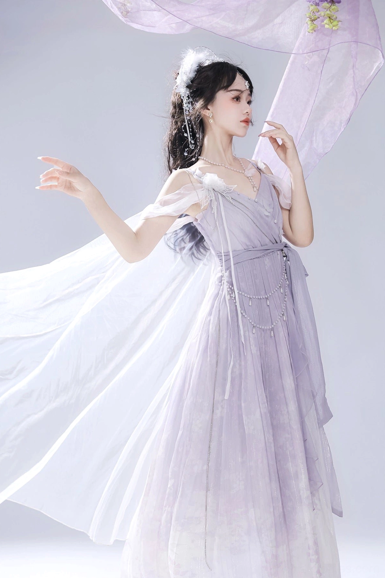 Side standing full-body shot of purple gradient Lolita slip dress with cold-shoulder straps and pearl chains