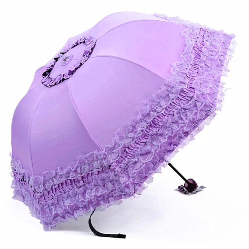 Purple foldable lolita parasol showcasing intricate embroidery work and decorative metal accents with dimensional floral patterns throughout canopy