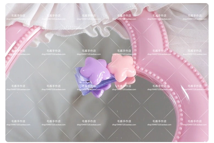Purple and pink star hair clip pairing combining two complementary pastel colors for balanced lolita hairstyling