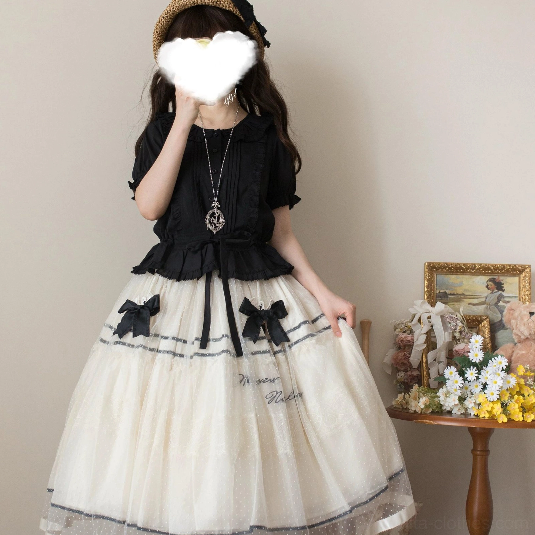 Purple or plum sweet Lolita short-sleeve blouse showing ruffled Peter Pan collar, front pintuck details, drawstring waist, and ruffled sleeve and hem finishes